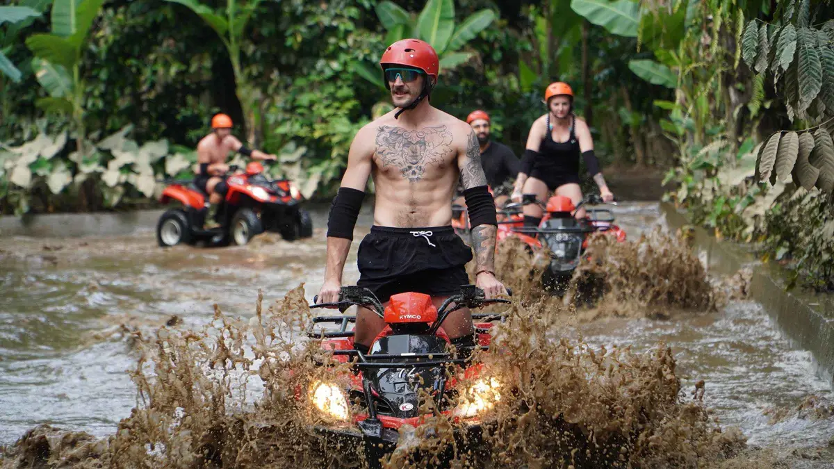 Quad bike emerging from the Gorilla Face Cave tunnel on an ATV tour in Ubud, Bali
