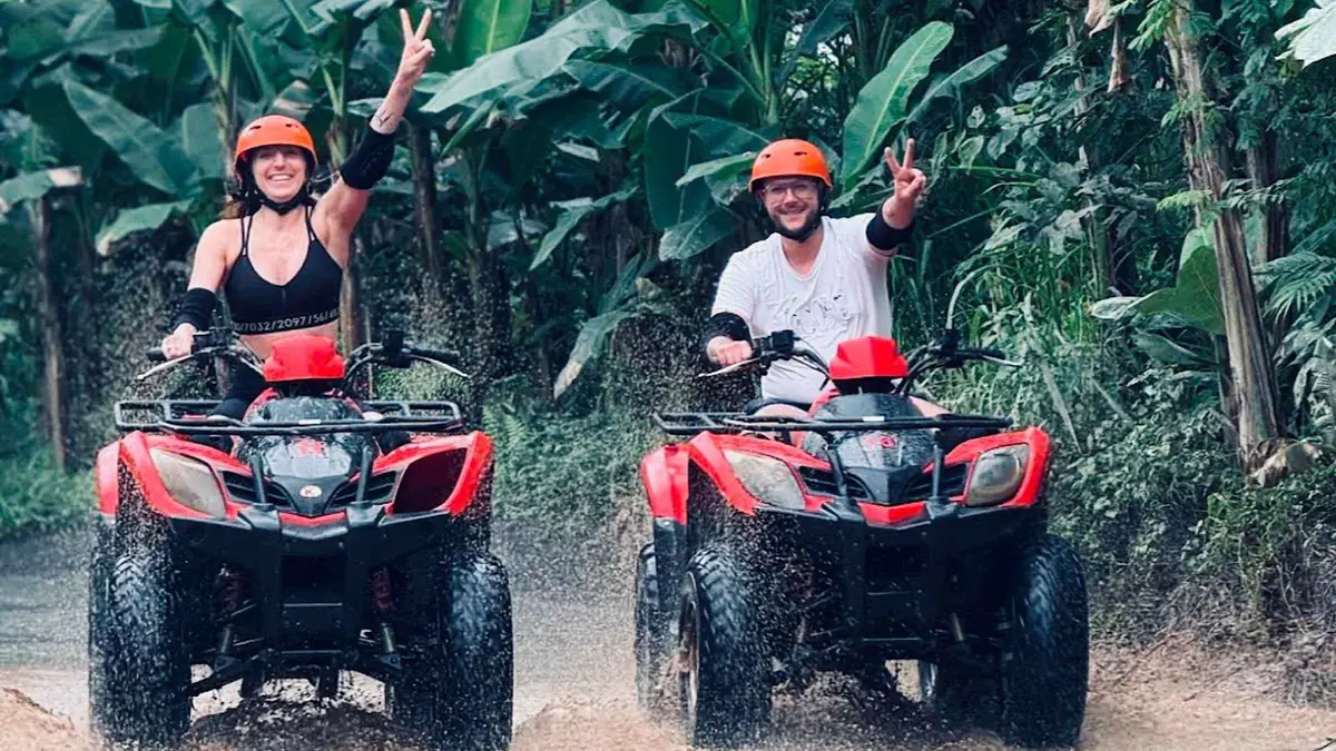 Quad bike on a rice-paddy trail near Tegalalang on an ATV and jungle swing tour in Ubud, Bali